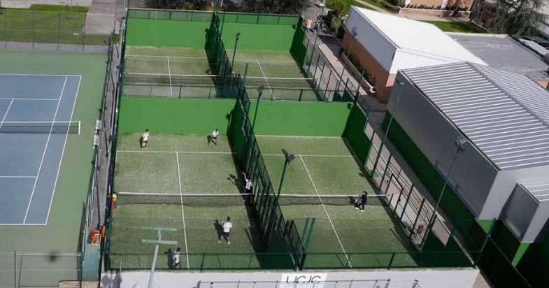 Vintage outdoor padel court with green surface